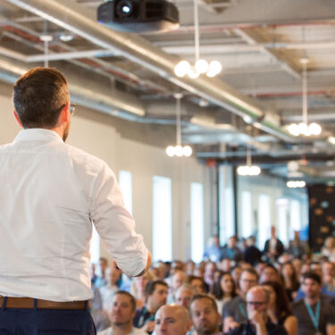 boss-speaking-on-stage